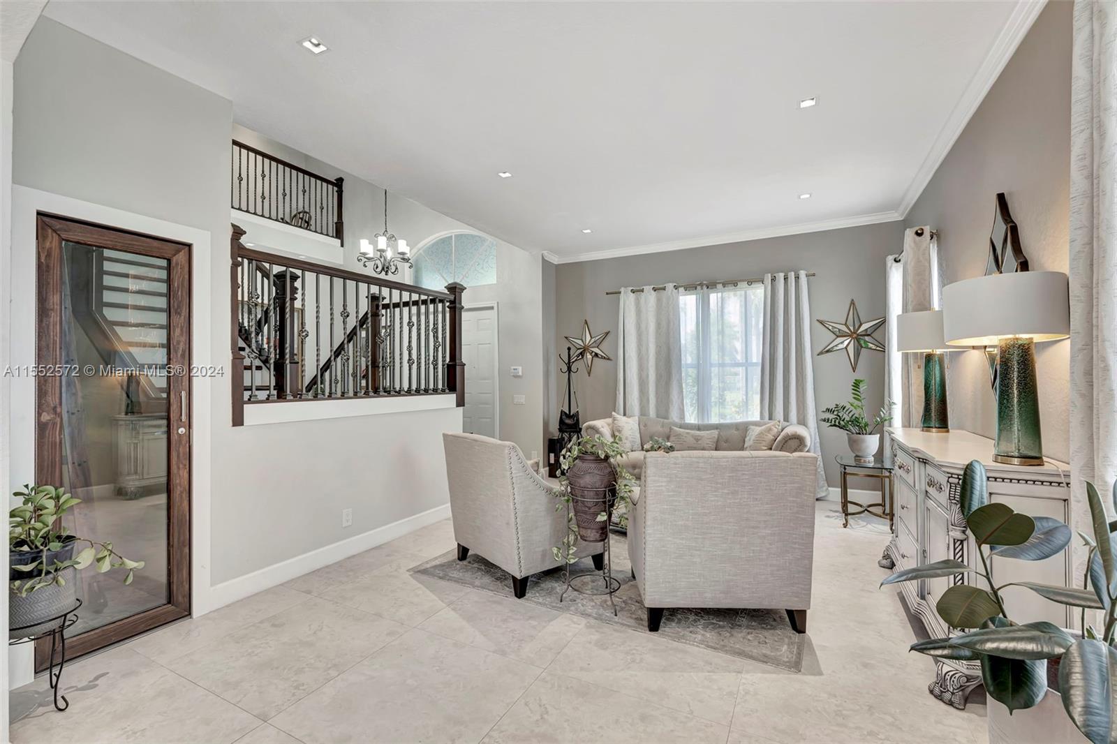 809 Regal Cove Road Weston, FL 33327 - Photo 49 of 70 a living room with furniture and a window