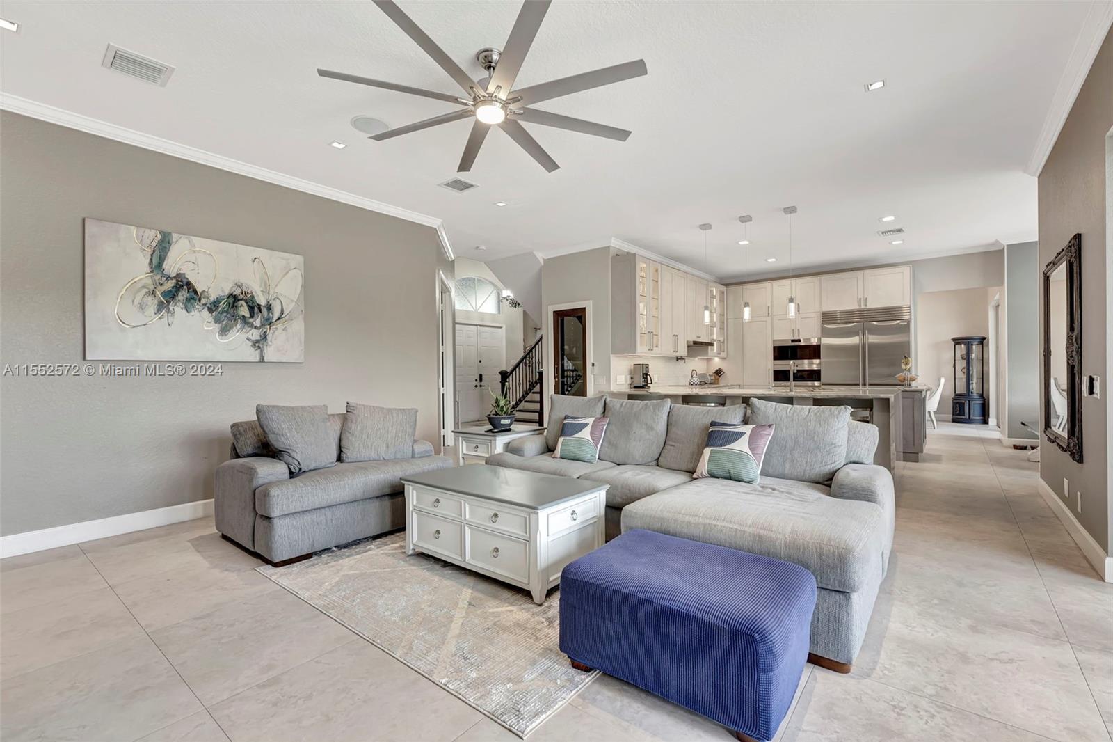 809 Regal Cove Road Weston, FL 33327 - Photo 55 of 70 a living room with furniture and a view of kitchen