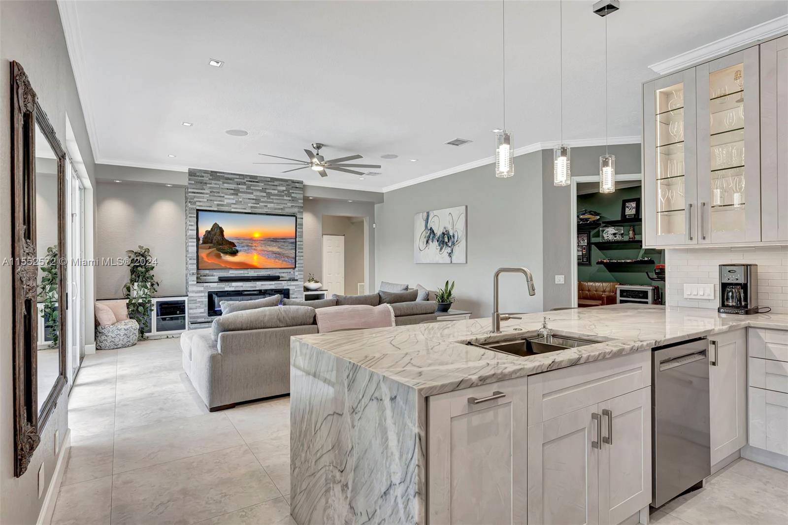 809 Regal Cove Road Weston, FL 33327 - Photo 60 of 70 a kitchen with sink stove and cabinets