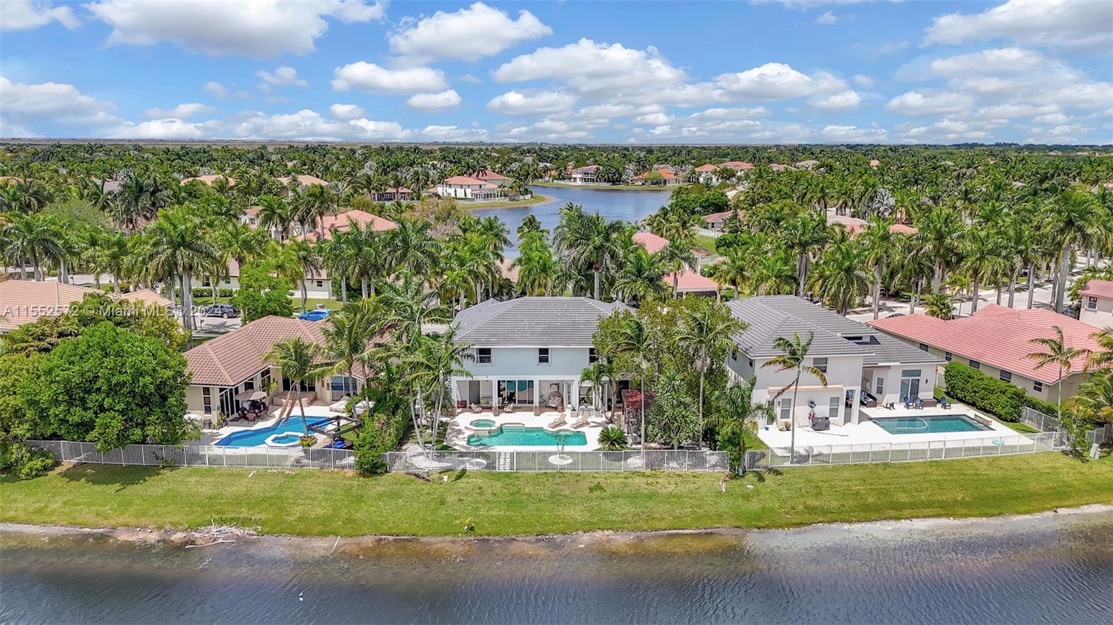 809 Regal Cove Road Weston, FL 33327 - Photo 6 of 70 a aerial view of a house with a yard basket ball court and outdoor seating