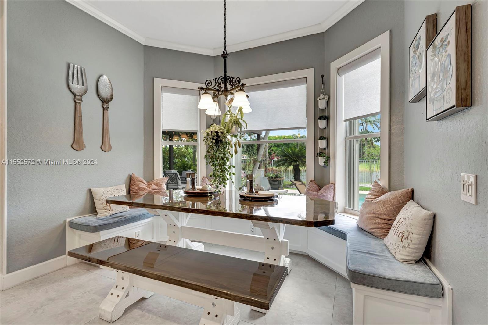 809 Regal Cove Road Weston, FL 33327 - Photo 61 of 70 a living room with furniture and a chandelier