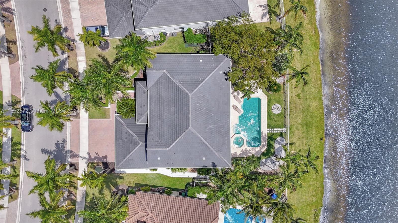 809 Regal Cove Road Weston, FL 33327 - Photo 7 of 70 an aerial view of a house with a yard and a bench