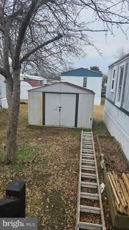 a view of a yard with wooden stairs