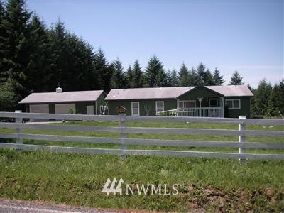 148 Minkler Road Winlock, WA 98596 - Photo 1 of 1 a front view of a house with a yard