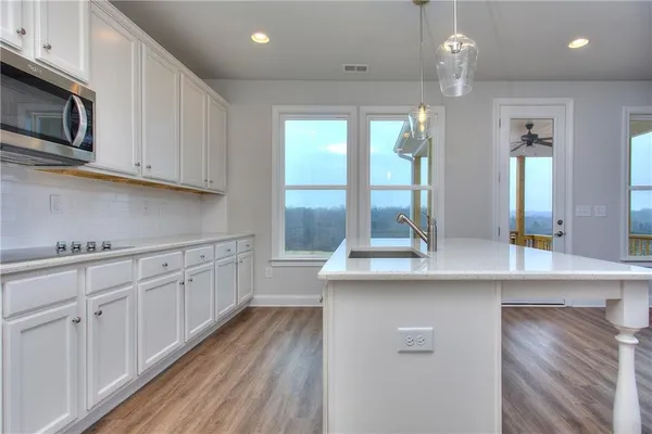 a kitchen with sink cabinets and window