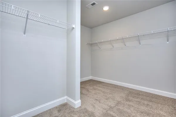 a view of an empty walk in closet