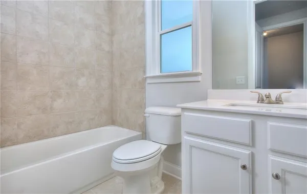 a bathroom with a sink toilet and bathtub
