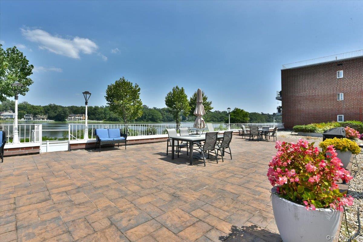 320 East Shore Road, Unit 2A Great Neck, NY 11023 - Photo 15 of 26 a view of outdoor space with garden and seating