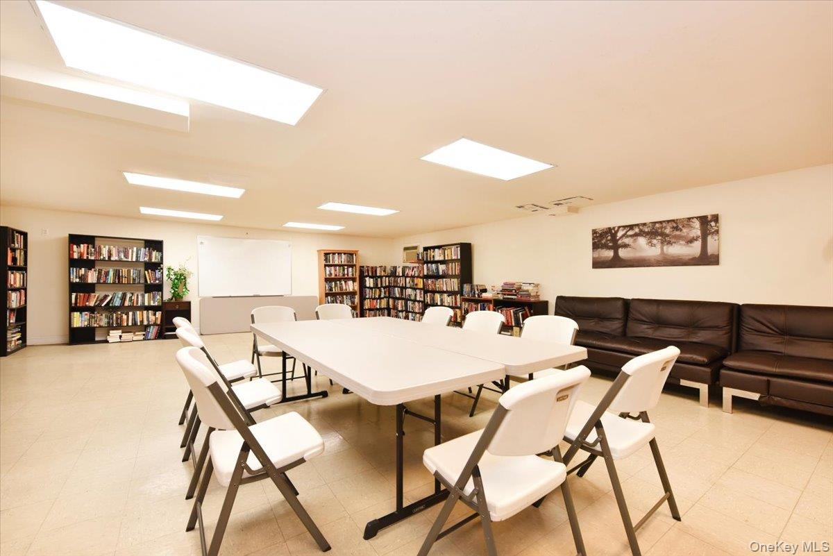 320 East Shore Road, Unit 2A Great Neck, NY 11023 - Photo 21 of 26 a view of a dining room with furniture