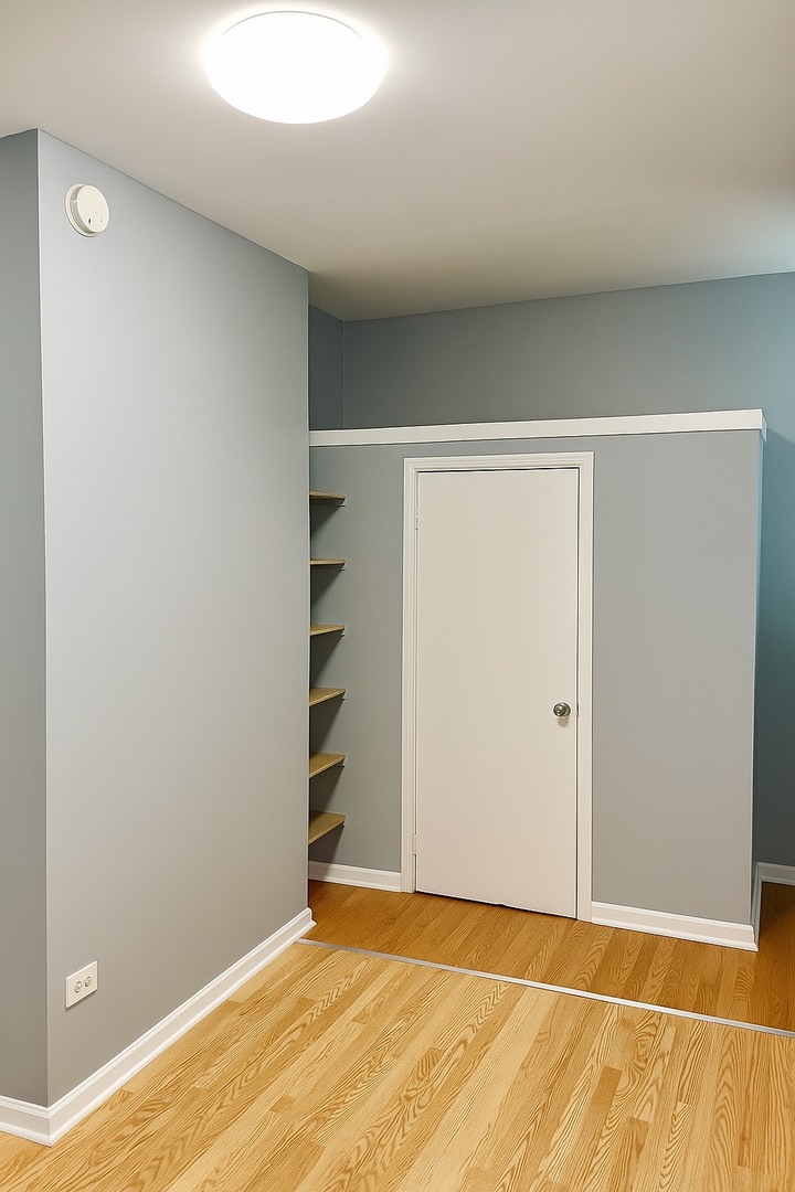 5412 South Damen Avenue, Unit 1 Chicago, IL 60609 - Photo 6 of 9 a view of an empty room with closet and a window