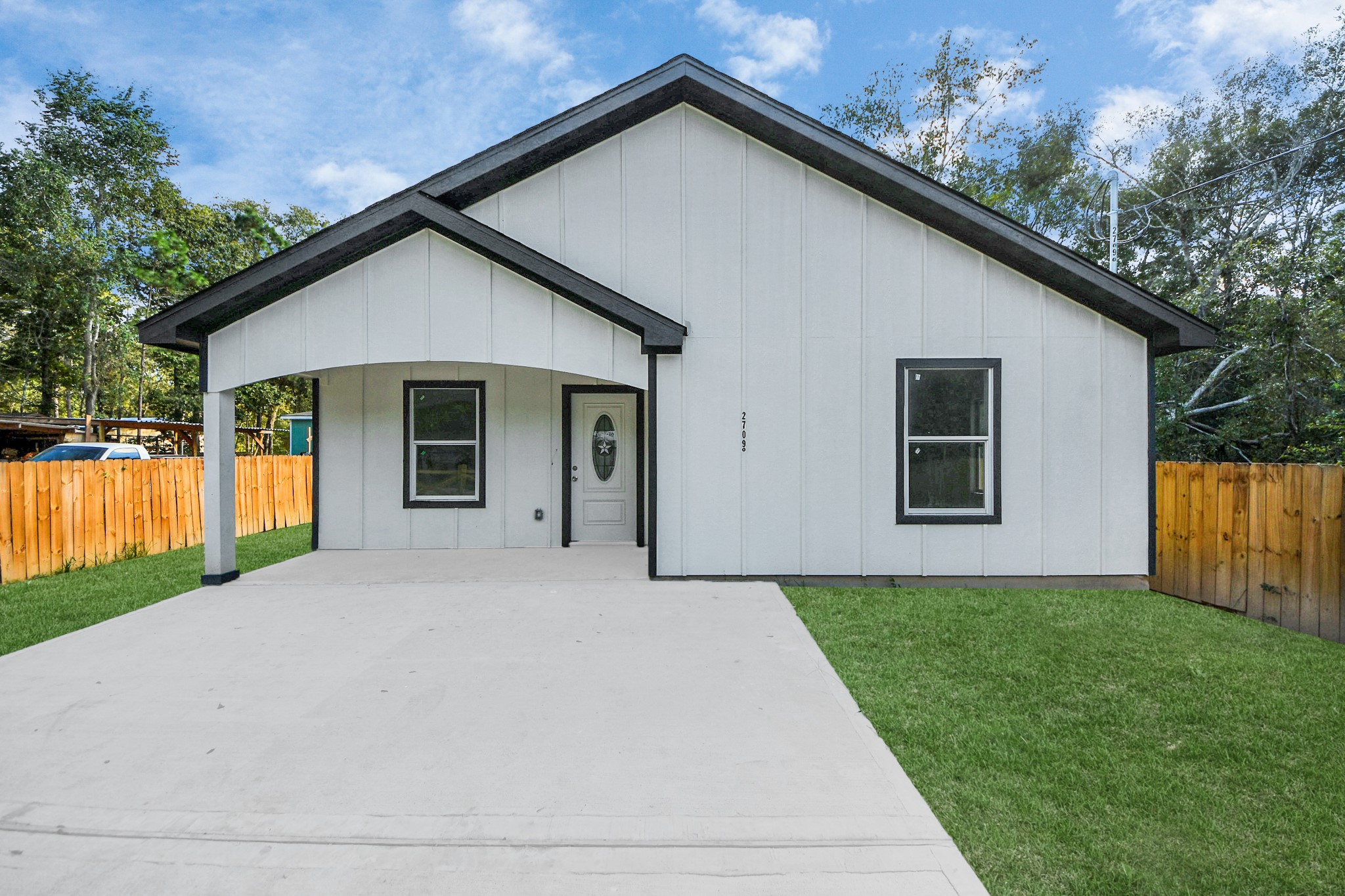 a front view of house with yard and green space