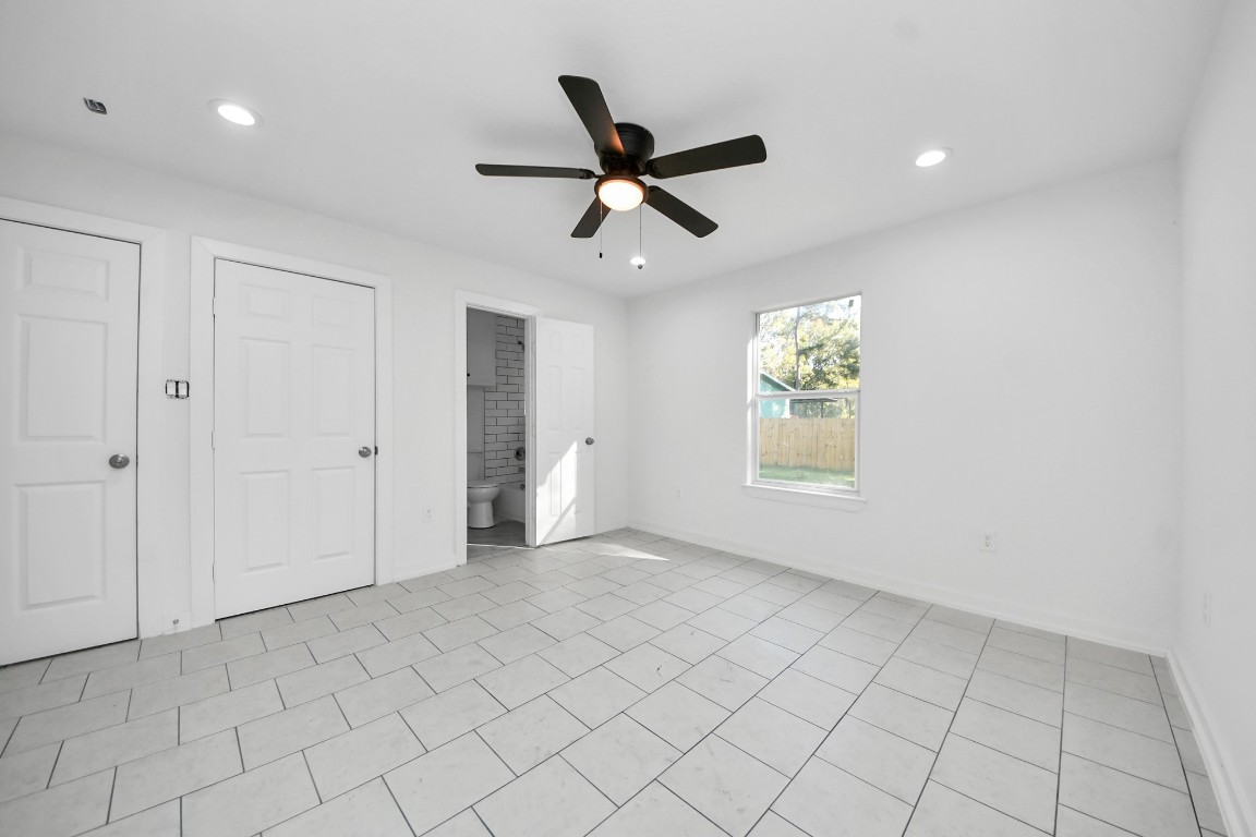 27090 Diamond C Splendora, TX 77372 - Photo 14 of 20 a view of an empty room and window and ceiling fan