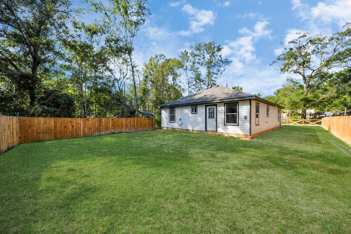 27090 Diamond C Splendora, TX 77372 - Photo 18 of 20 a view of a house with a backyard