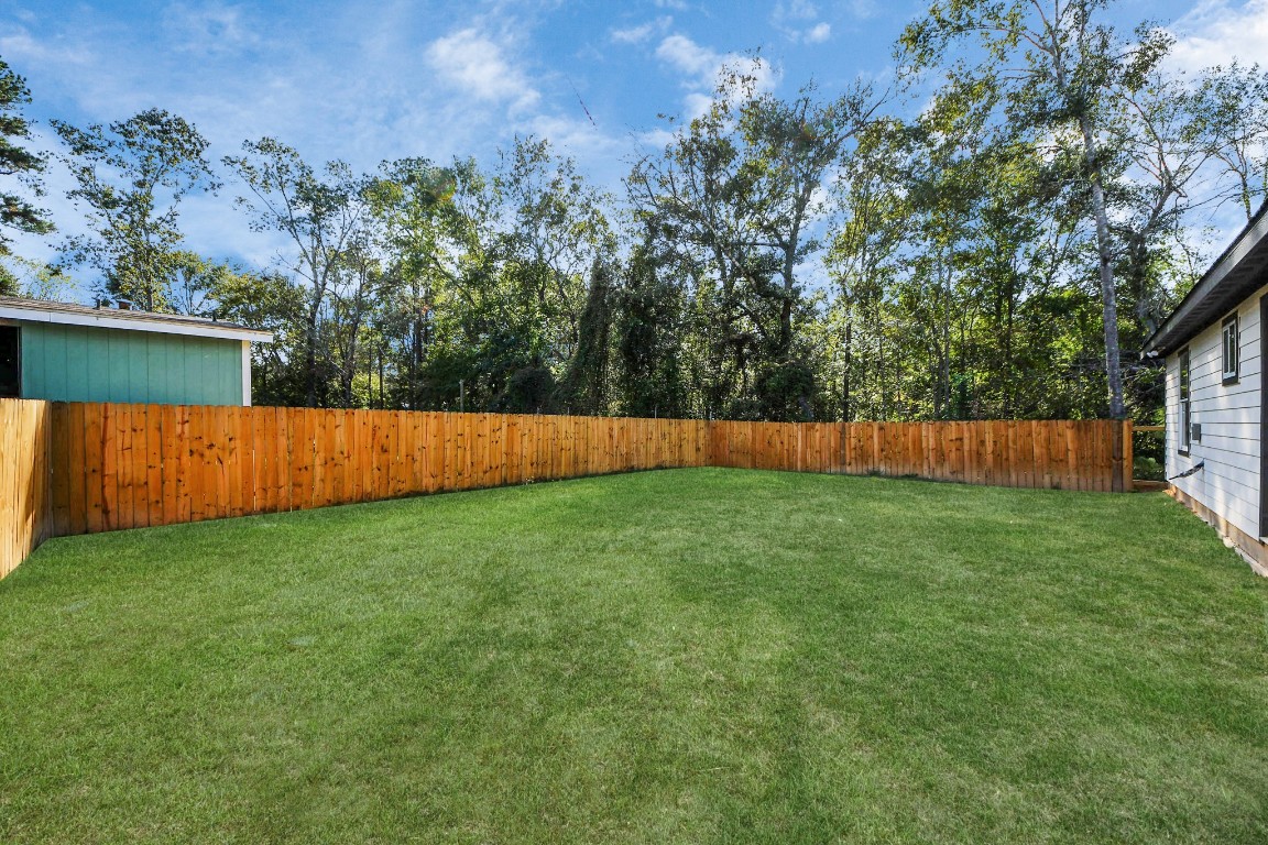 27090 Diamond C Splendora, TX 77372 - Photo 19 of 20 a view of backyard with wooden fence