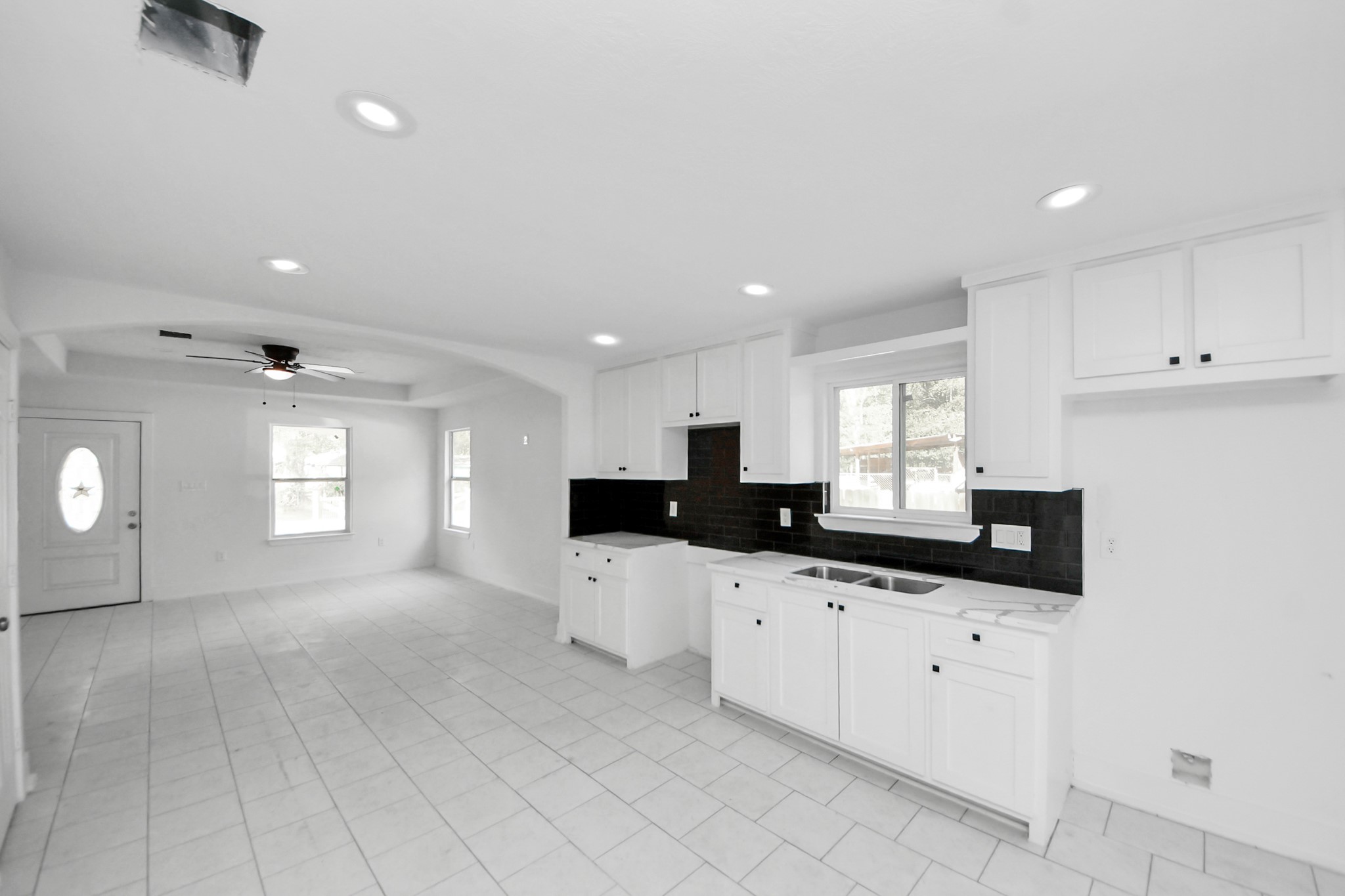 27090 Diamond C Splendora, TX 77372 - Photo 4 of 20 a kitchen with granite countertop white cabinets and sink