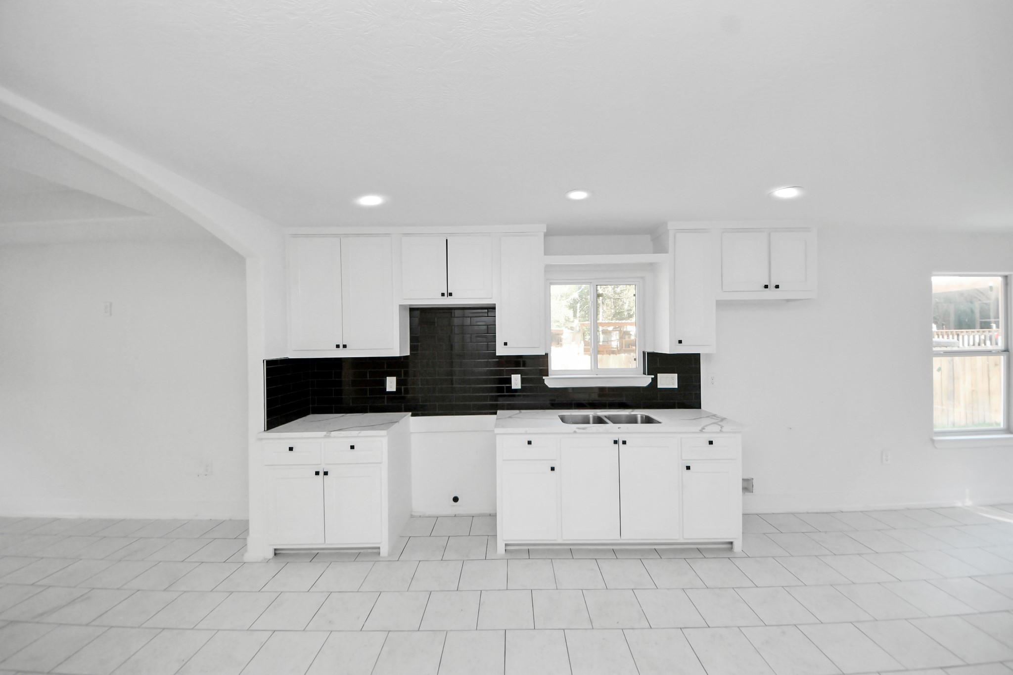 27090 Diamond C Splendora, TX 77372 - Photo 5 of 20 a kitchen with granite countertop a sink a stove a microwave and cabinets