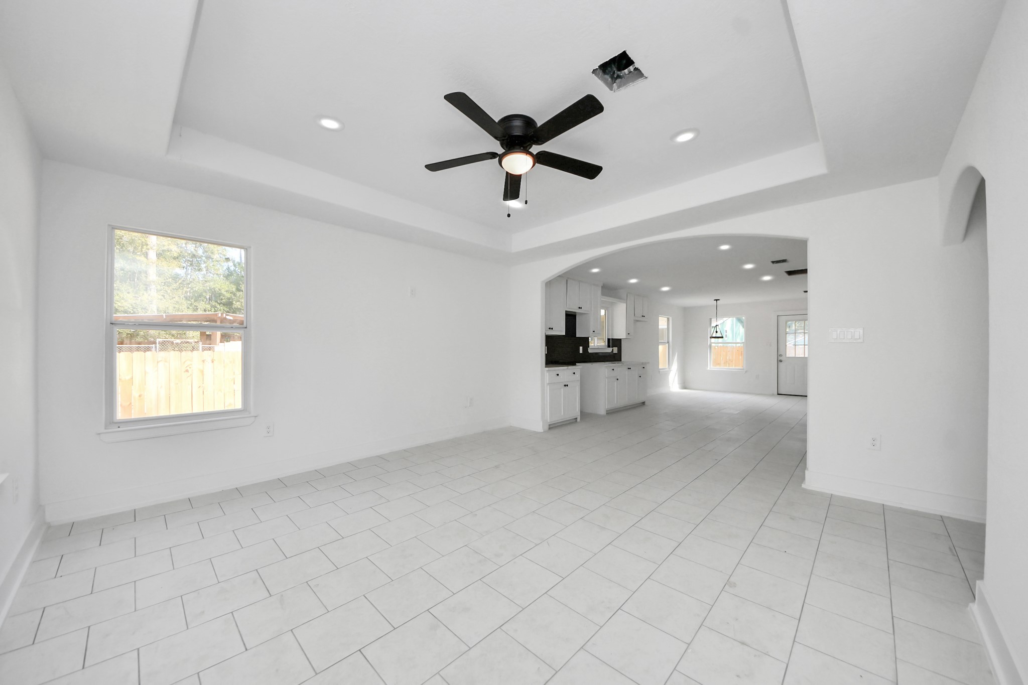 27090 Diamond C Splendora, TX 77372 - Photo 8 of 20 a view of a livingroom with a ceiling fan and window