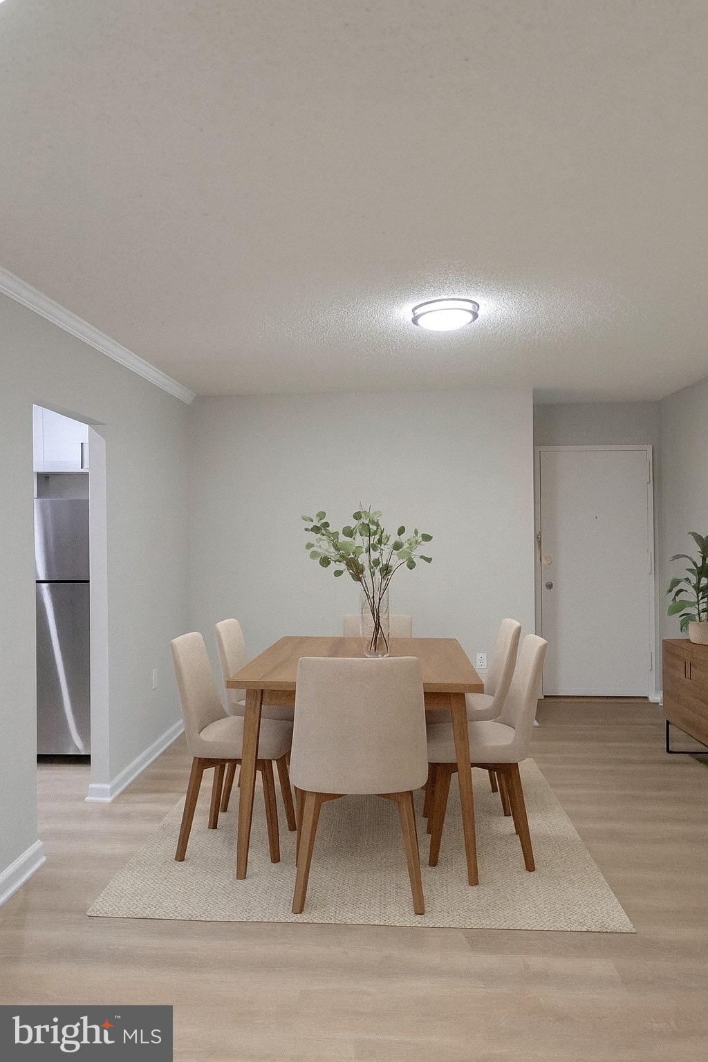 3801 Swann Road, Unit 303 Suitland, MD 20746 - Photo 6 of 20 Dining space. AI staged.