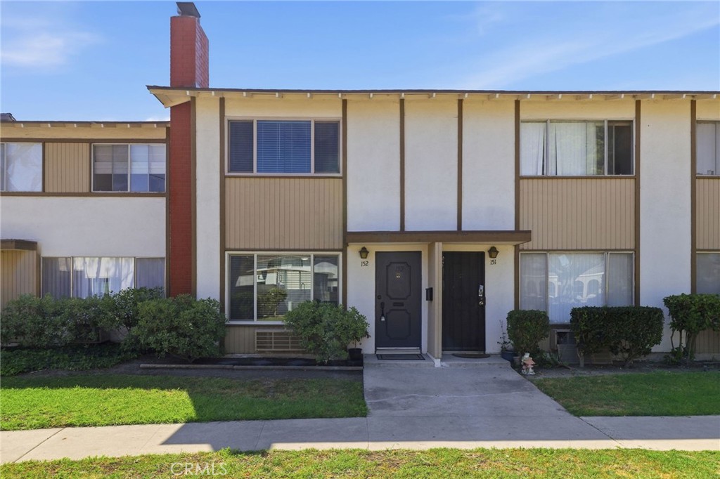 1722 Mitchell, Unit 152 Tustin, CA 92780 - Photo 21 of 25 a view of a house with a yard