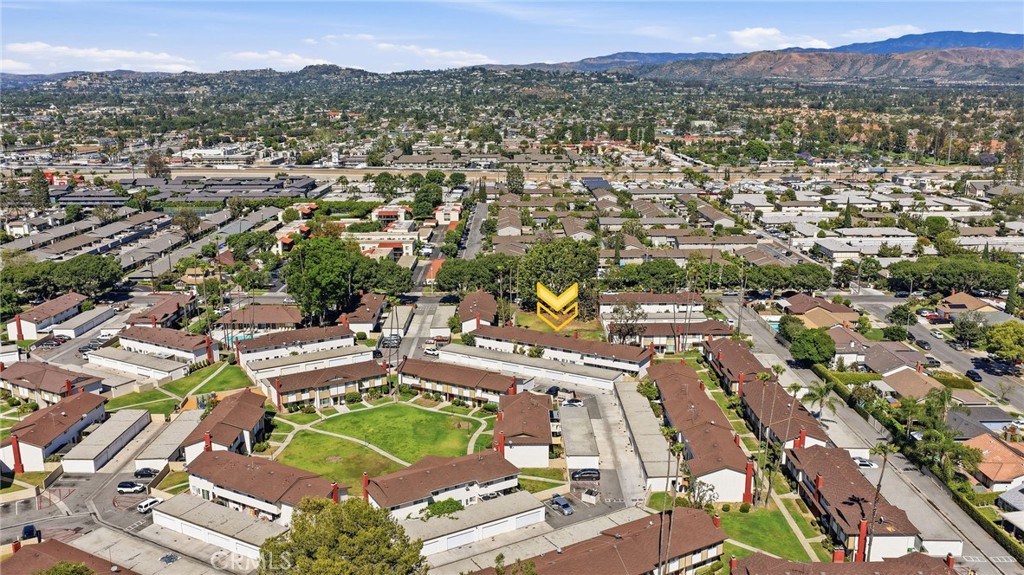 1722 Mitchell, Unit 152 Tustin, CA 92780 - Photo 22 of 25 an aerial view of residential house with outdoor space