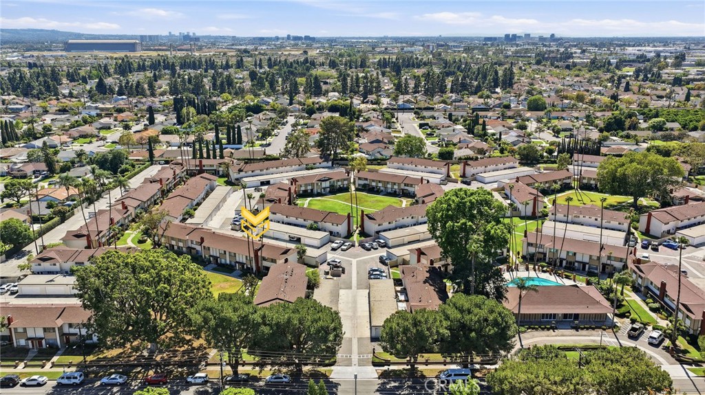 1722 Mitchell, Unit 152 Tustin, CA 92780 - Photo 23 of 25 an aerial view of a house with a swimming pool