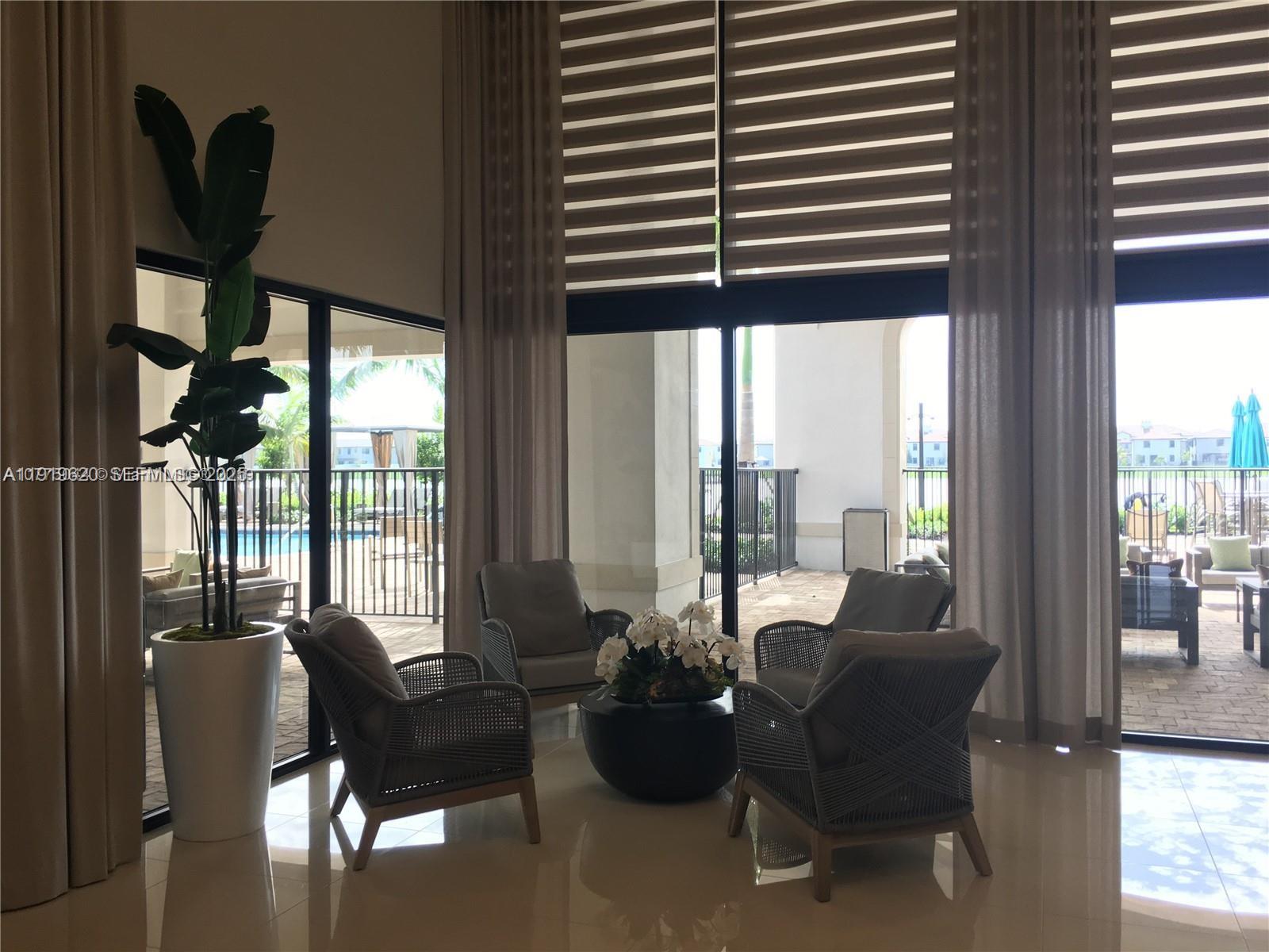 3388 West 100th Terrace Hialeah, FL 33018 - Photo 11 of 13 a living room with furniture and a window