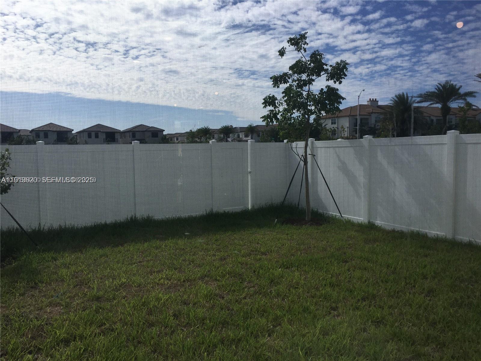 3388 West 100th Terrace Hialeah, FL 33018 - Photo 3 of 13 a view of a backyard