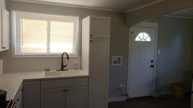 a bathroom with a sink and a window
