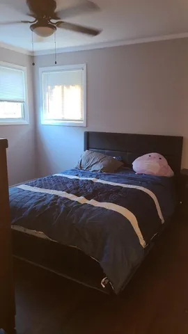 a bedroom with a bed and window