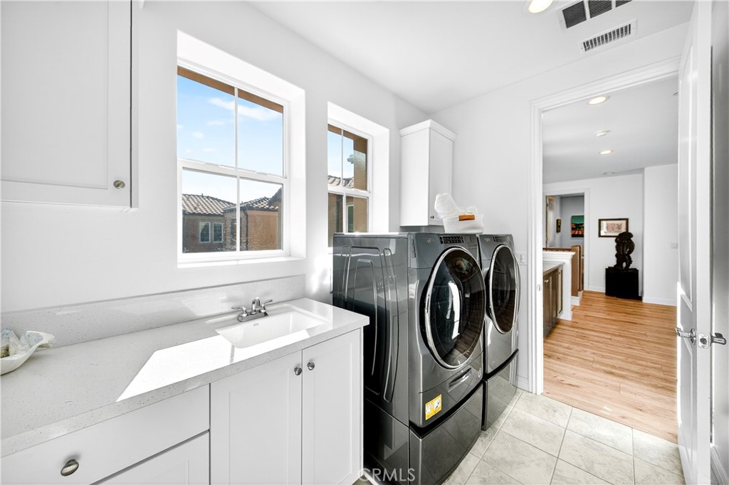 20851 Acorn Circle Porter Ranch, CA 91326 - Photo 15 of 26 a view of a kitchen with sink washer and dryer