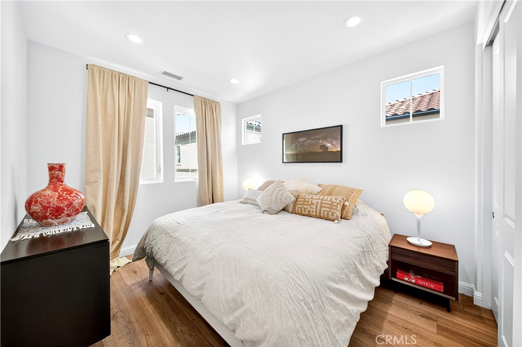 20851 Acorn Circle Porter Ranch, CA 91326 - Photo 16 of 26 a bedroom with a bed and window