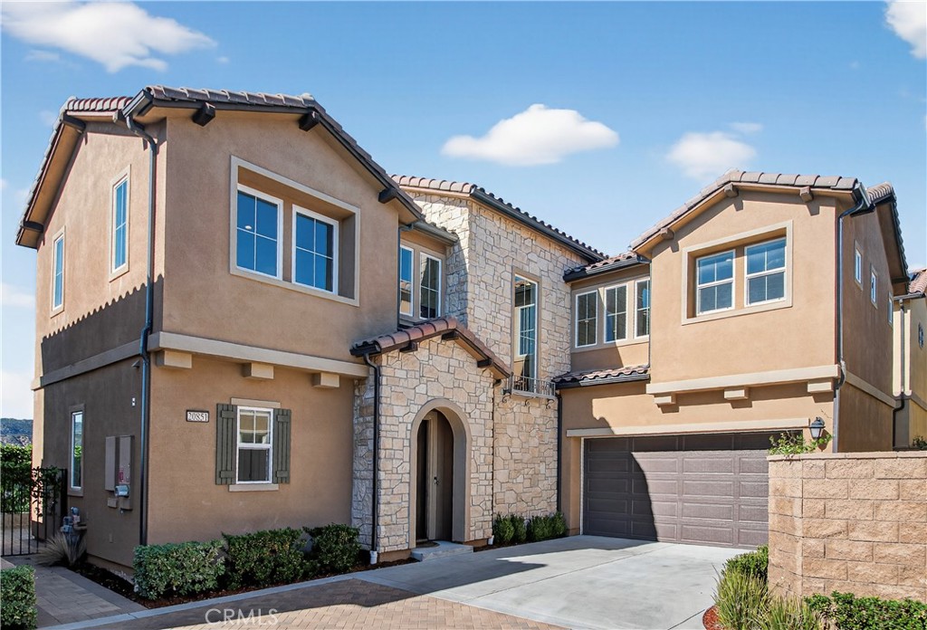 20851 Acorn Circle Porter Ranch, CA 91326 - Photo 23 of 26 a front view of a house with a yard