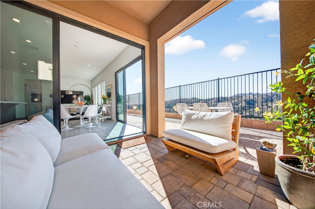 20851 Acorn Circle Porter Ranch, CA 91326 - Photo 9 of 26 a living room with furniture and a potted plant