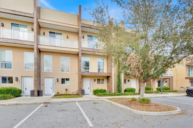 a view of a brick building next to a road