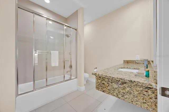 a bathroom with a shower and a sink