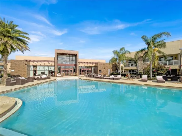 a view of a swimming pool and a chair