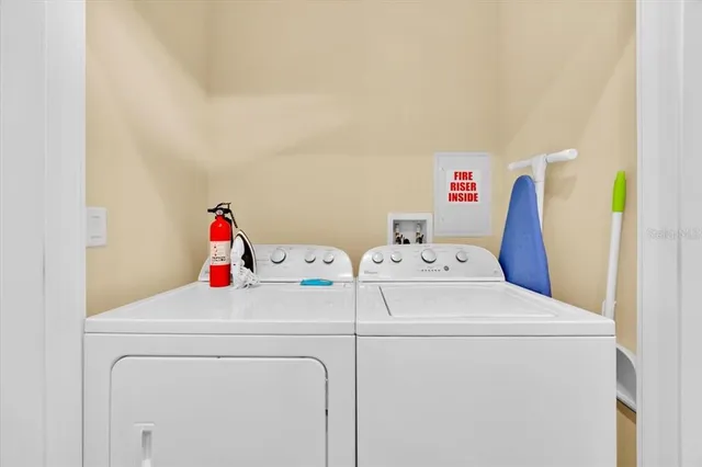 a utility room with dryer and washer