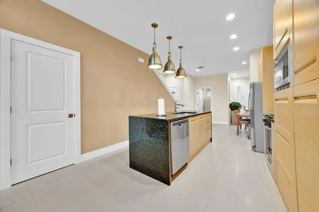 a view of living room with furniture and a ceiling fan