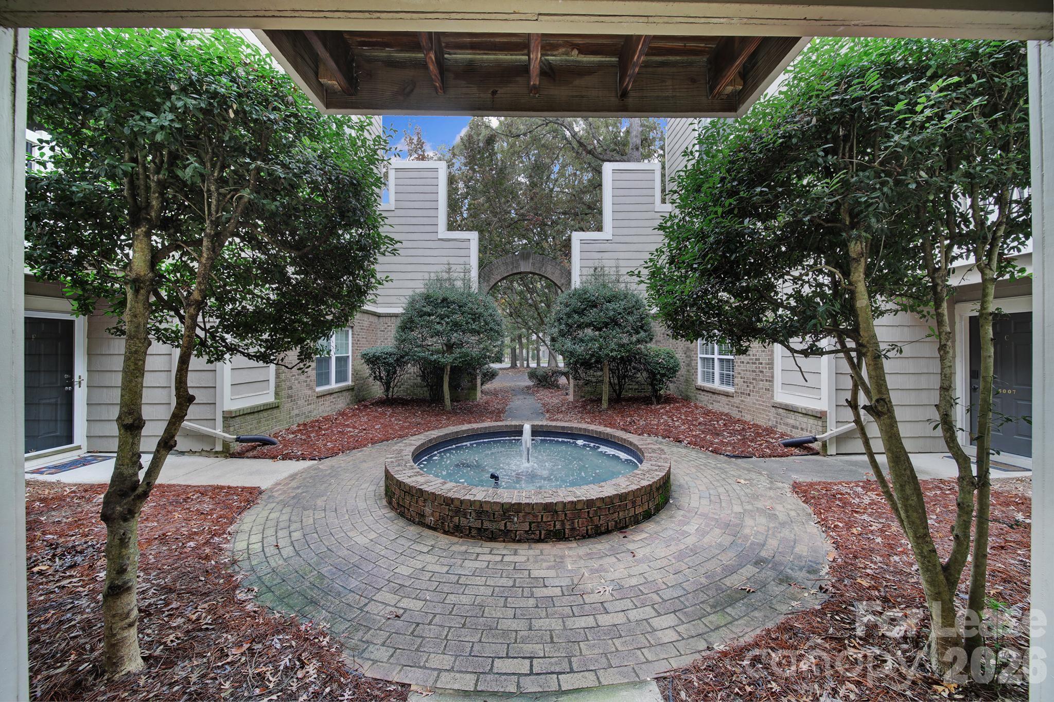 5007 Sharon Road, Unit E Charlotte, NC 28210 - Photo 23 of 24 a view of a swimming pool with a patio