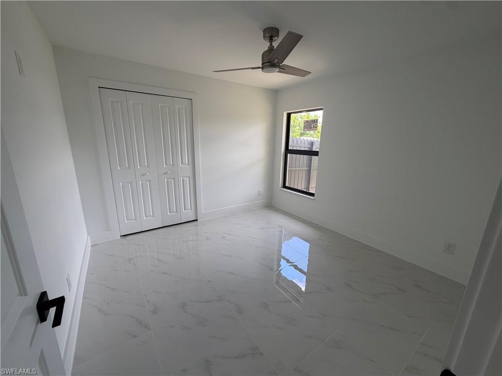 15 Louisiana Road Lehigh Acres, FL 33936 - Photo 9 of 22 a view of an empty room with windows