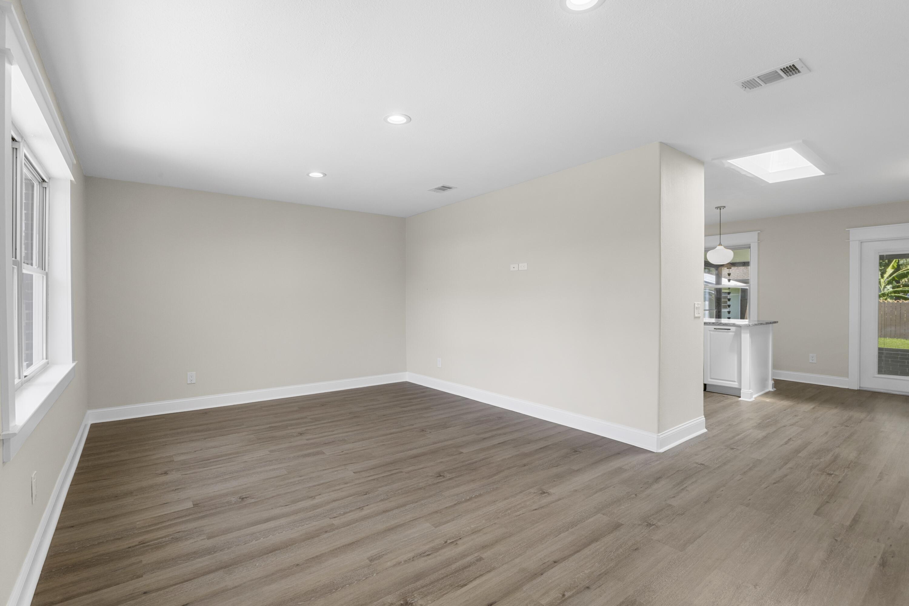 308 Spring Lane Destin, FL 32541 - Photo 15 of 47 wooden floor in an empty room with a window