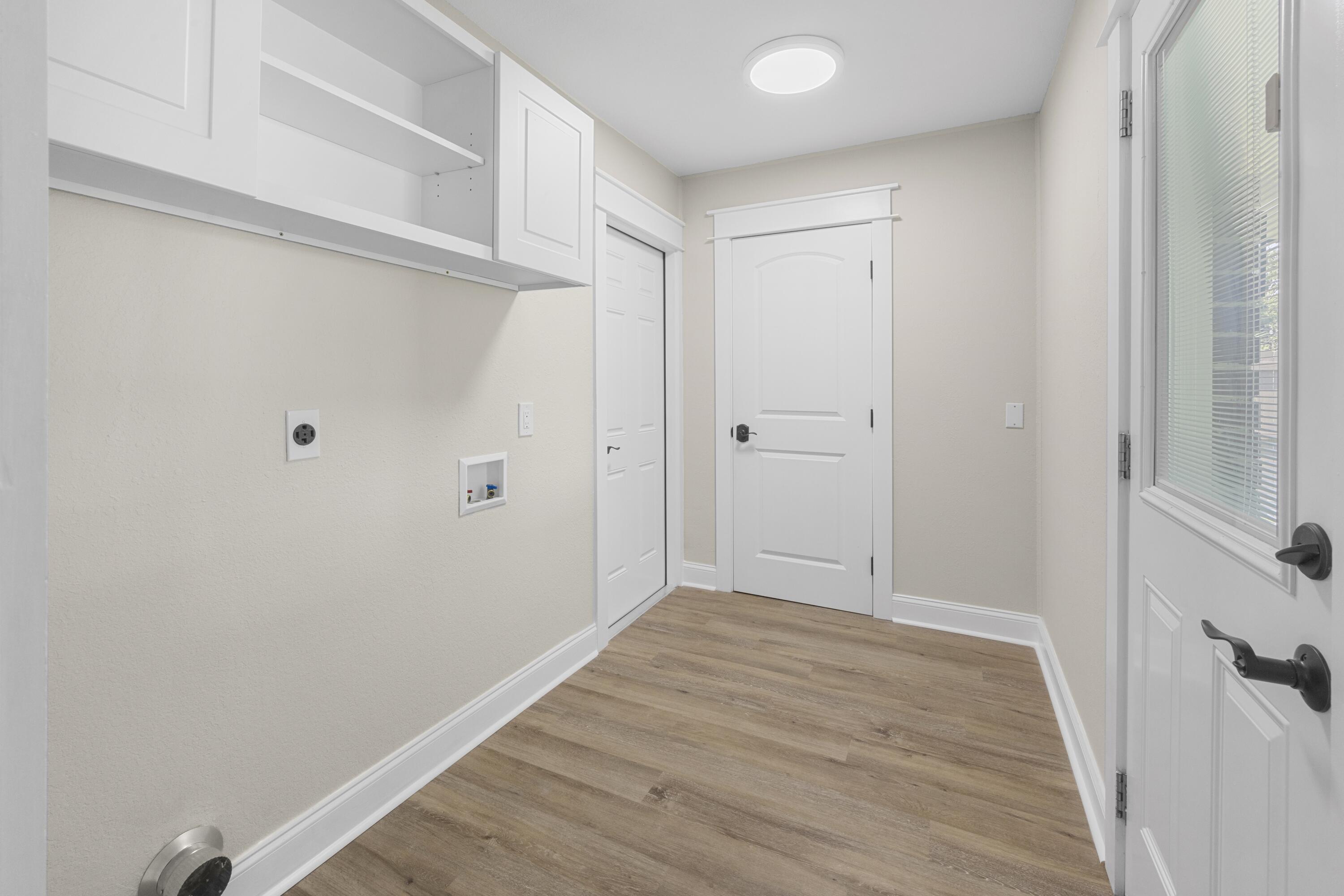 308 Spring Lane Destin, FL 32541 - Photo 17 of 47 a view of hallway with wooden floor