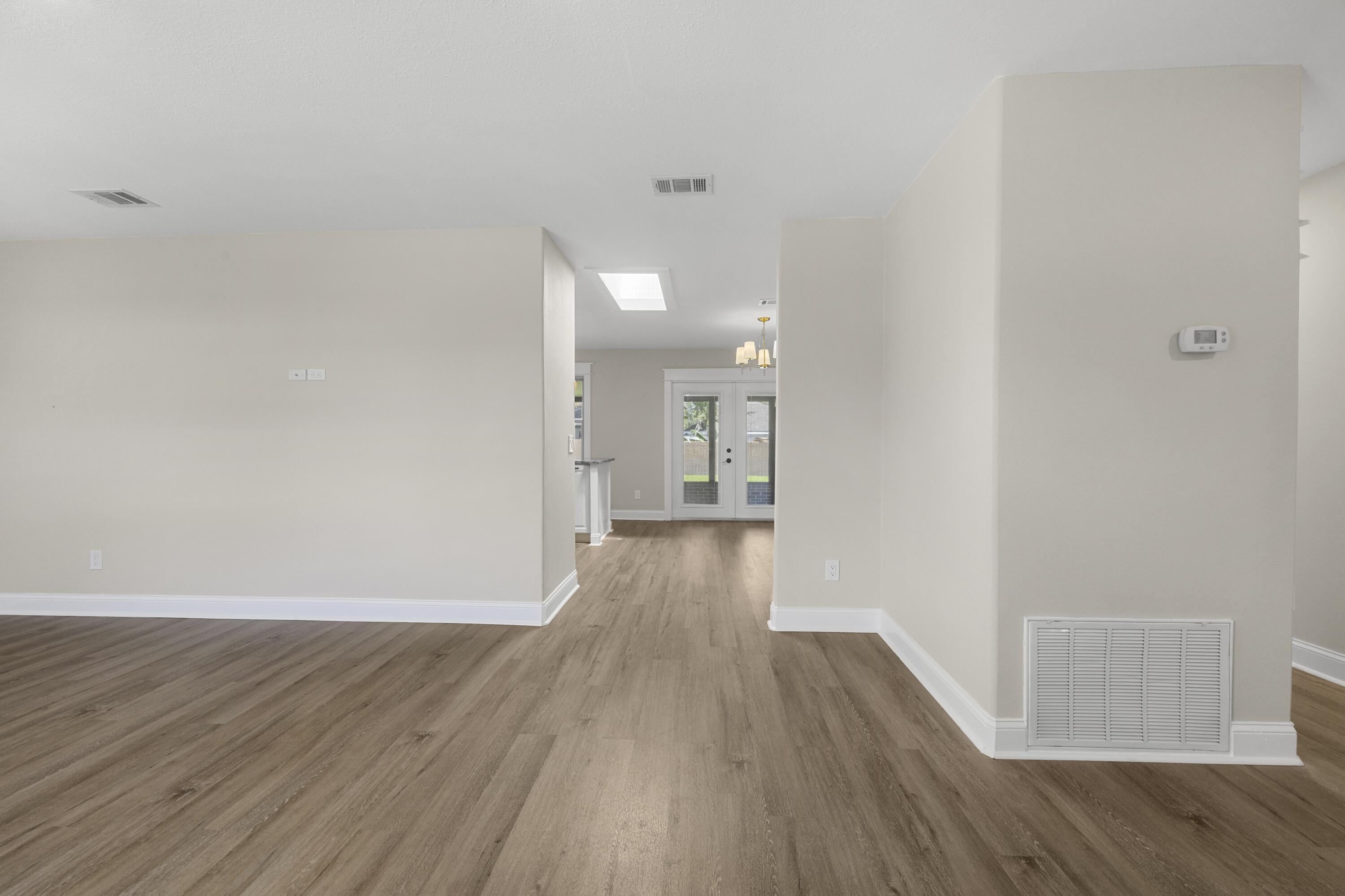 308 Spring Lane Destin, FL 32541 - Photo 29 of 47 a view of a room with wooden floor and a window