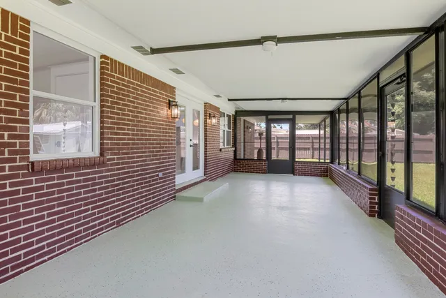 a house with swimming pool in front of it