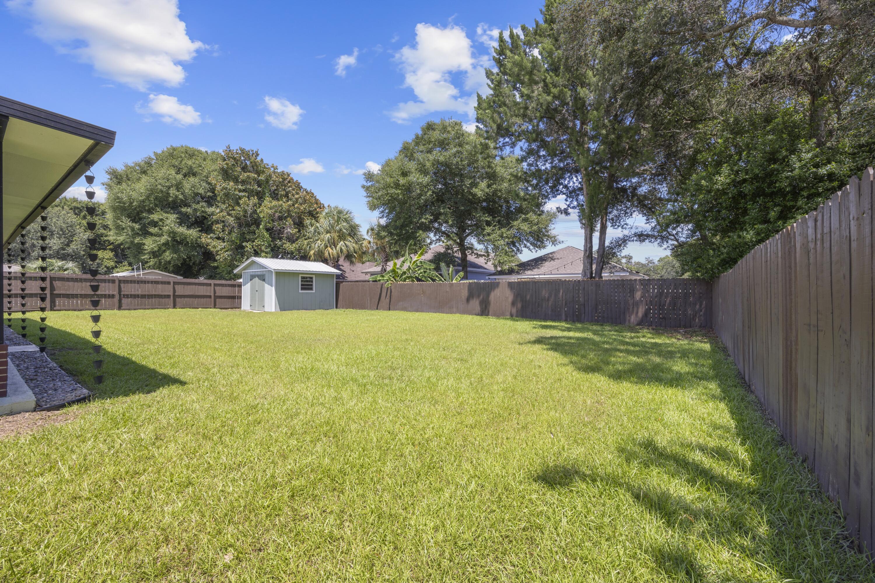 308 Spring Lane Destin, FL 32541 - Photo 35 of 47 a house with swimming pool in front of it