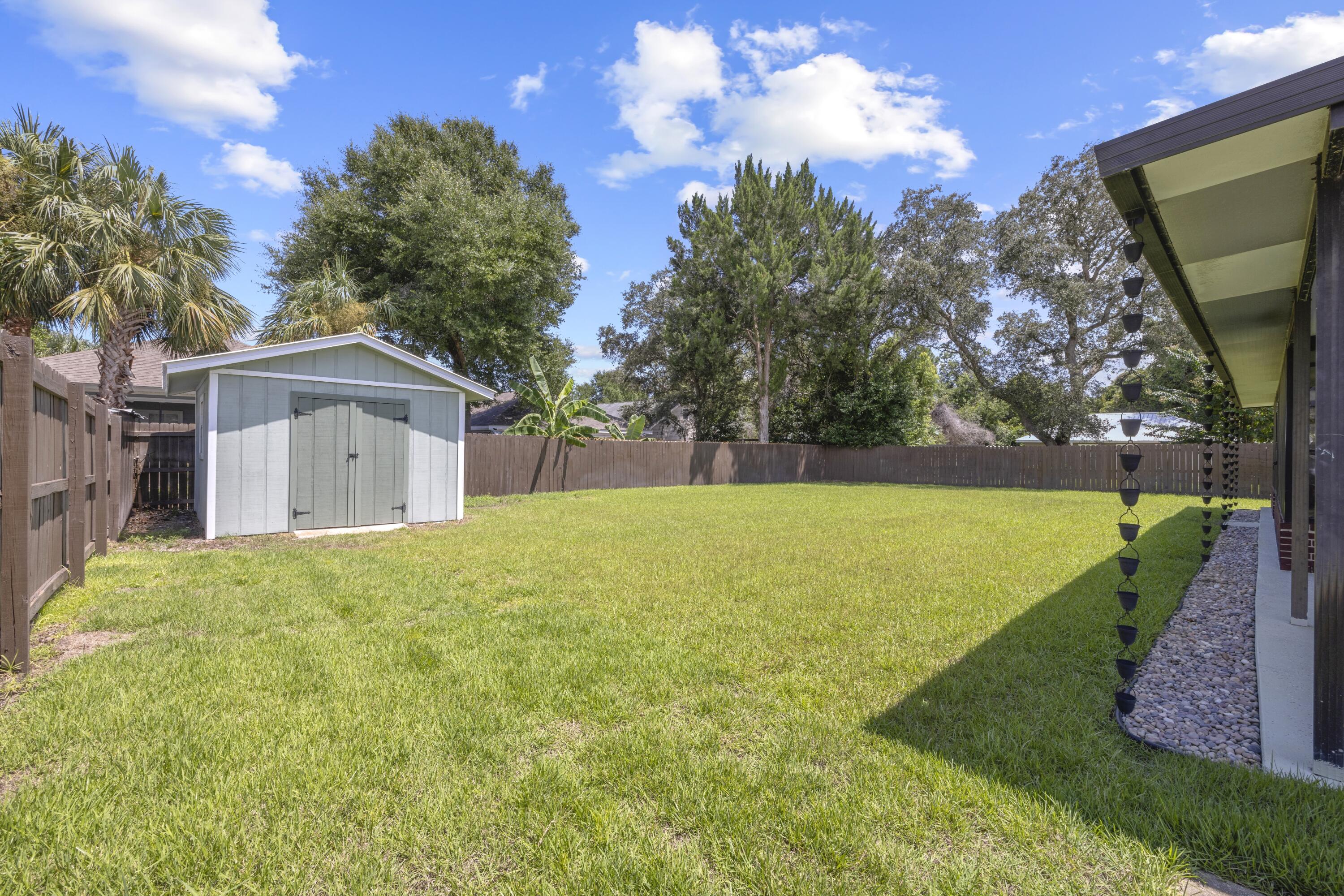 308 Spring Lane Destin, FL 32541 - Photo 38 of 47 a view of a house with backyard and garden