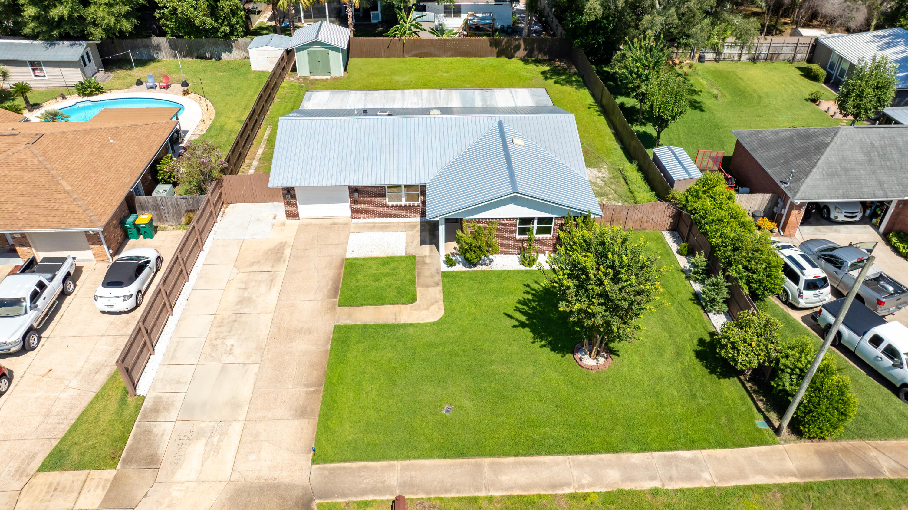 308 Spring Lane Destin, FL 32541 - Photo 44 of 47 an aerial view of a house with swimming pool and large trees
