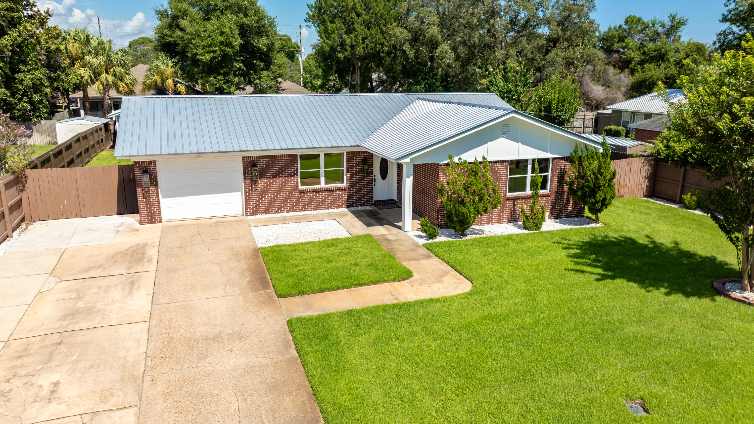 308 Spring Lane Destin, FL 32541 - Photo 45 of 47 a front view of a house with a yard