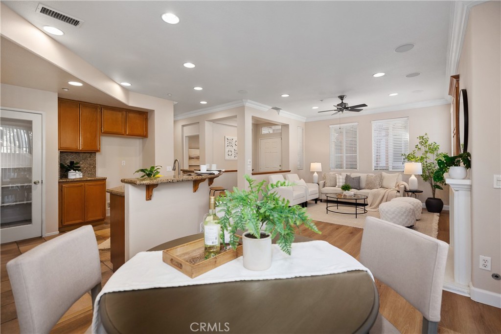 9 Lilac Irvine, CA 92618 - Photo 11 of 49 a living room with furniture kitchen view and a large window