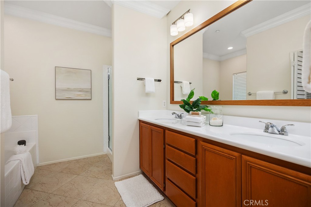 9 Lilac Irvine, CA 92618 - Photo 17 of 49 a bathroom with a granite countertop sink and a mirror